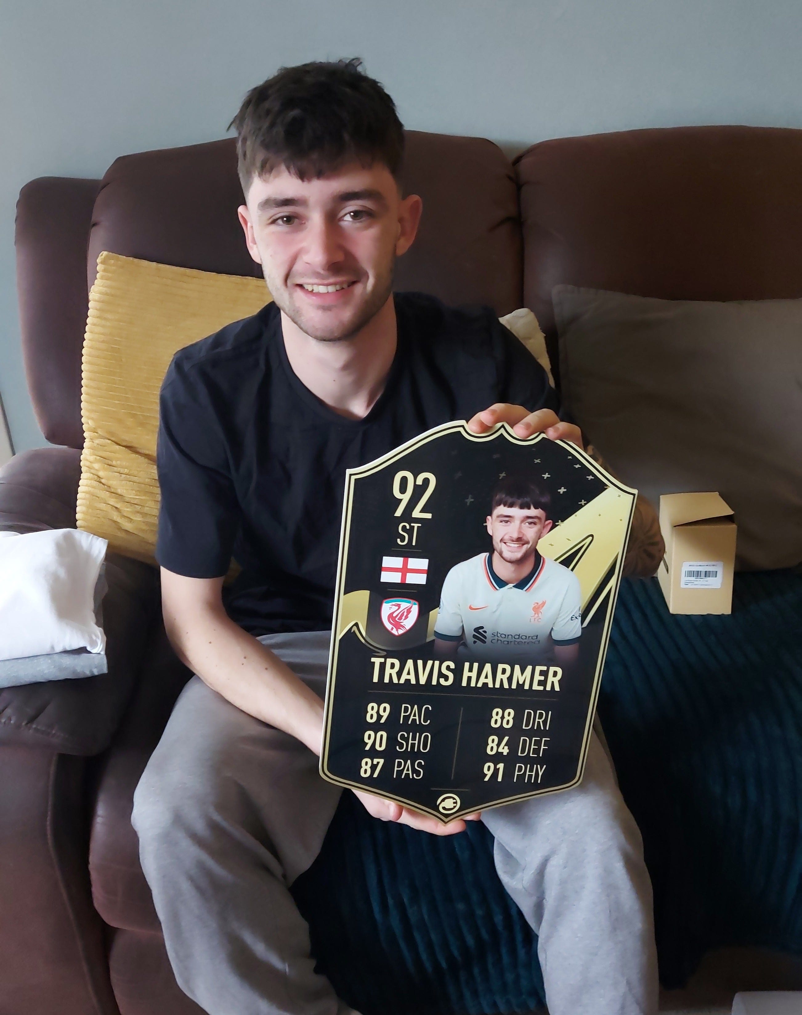 CardsPlug customer holding a personalised football card